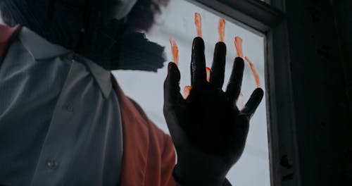Bloody Hand on Window Close up