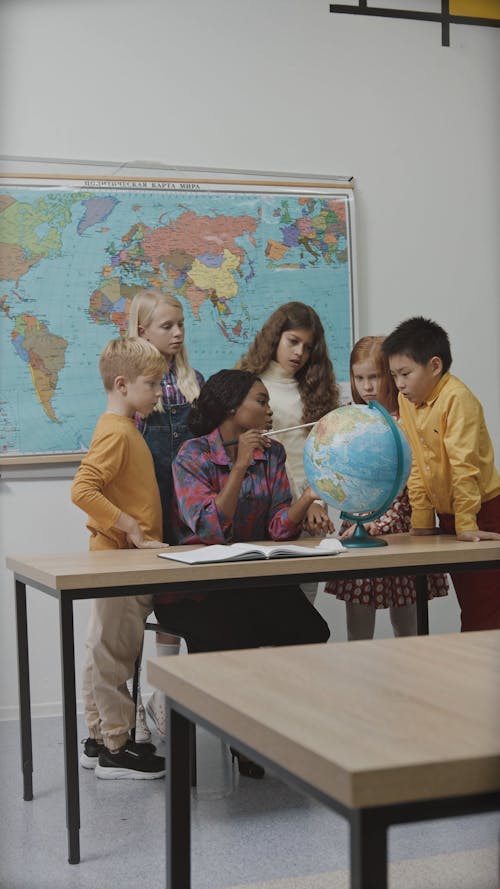 Teacher and Students in Geography Class