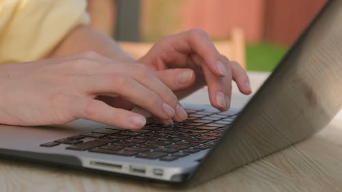 Female Hands Typing on Laptop Close up