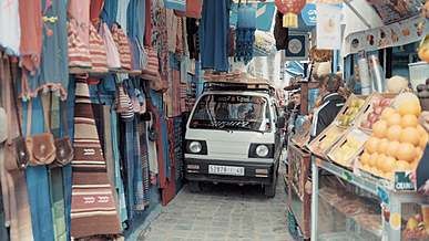 a pickup truck carrying wood planks