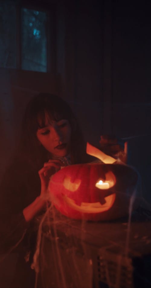Woman Looking at the Pumpkin