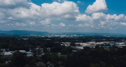 Time-lapse Video of White Clouds Over a City