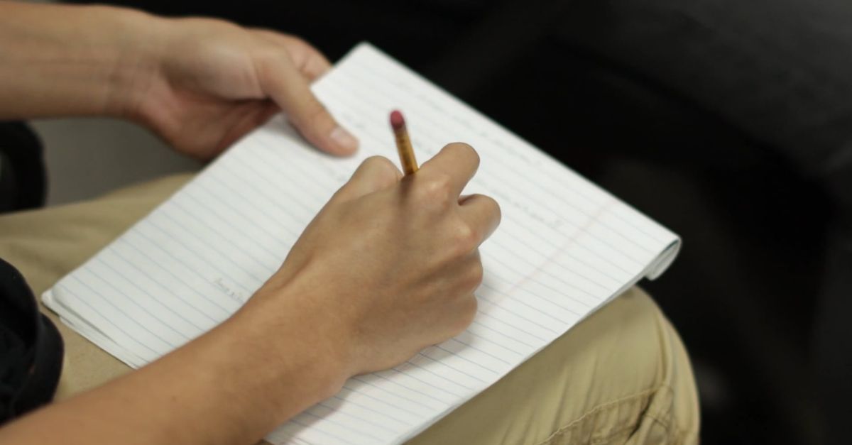 A Person Writing on a Notepad Free Stock Video Footage, Royalty-Free 4K ...