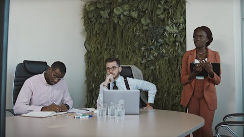 Men Listening To a Presentation in a Meeting