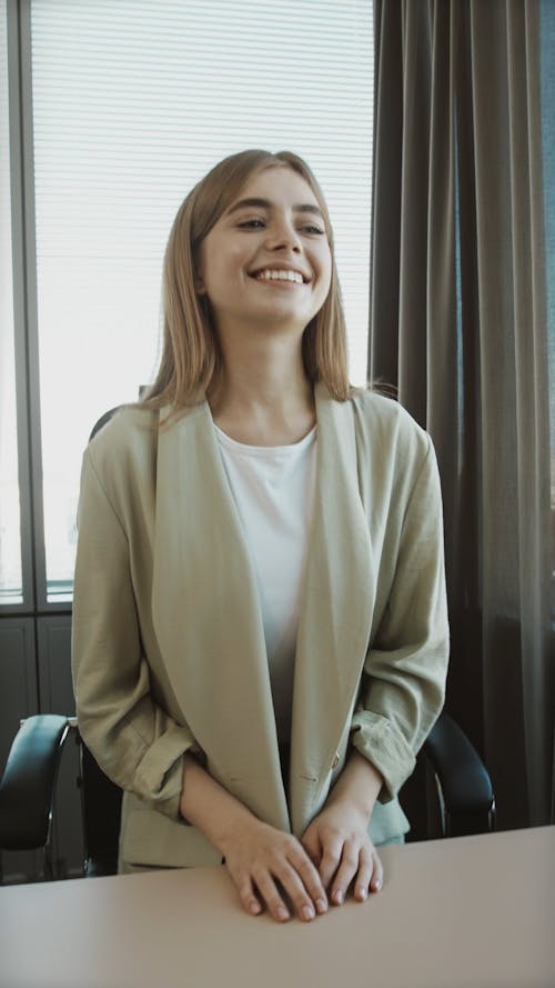 A Smiling Applicant Shaking Hands with the Interviewer