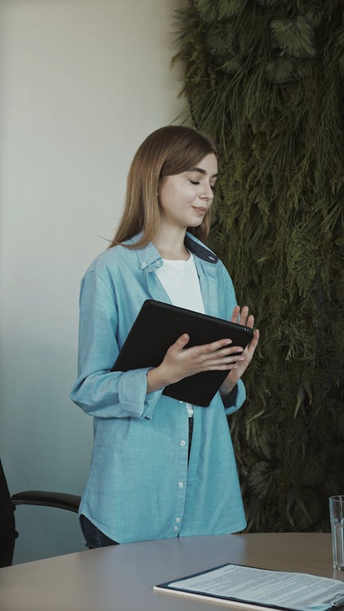 Woman Presenting in a Meeting