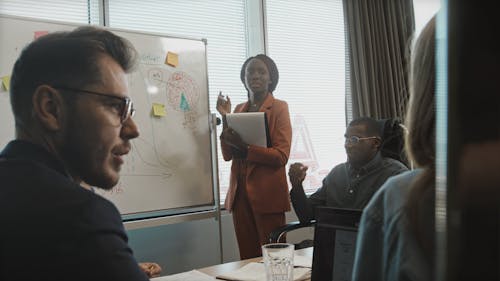 A Female Employee Giving Presentation