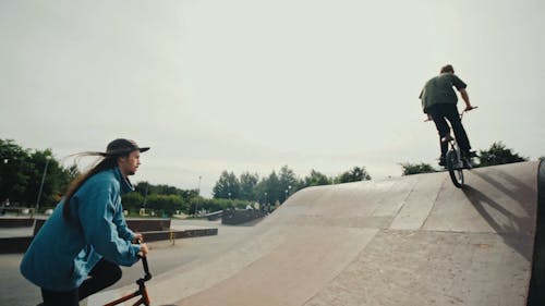 People Riding a Bicycle