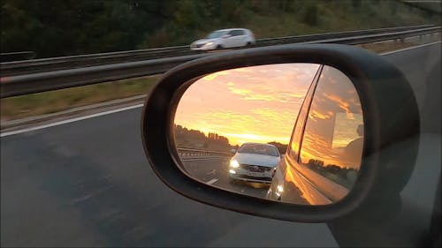 Over Taking Cars View through Rear View Mirror