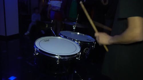 A Person Playing Drums 