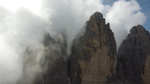 Clouds Floating Around Dolomite Mountain Peaks