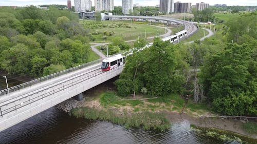 Aerial Shot of a Train Passing by the Railroad