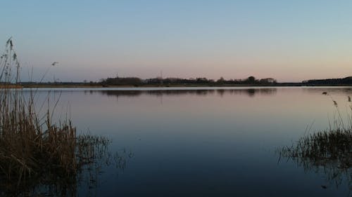 Flying A Drone Over The Lake Surface