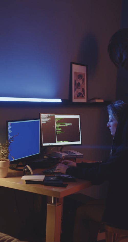 Side View of a Young Girl Typing Codes on Computer