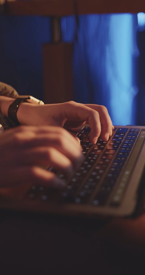 Video of a Person Typing on a Laptop