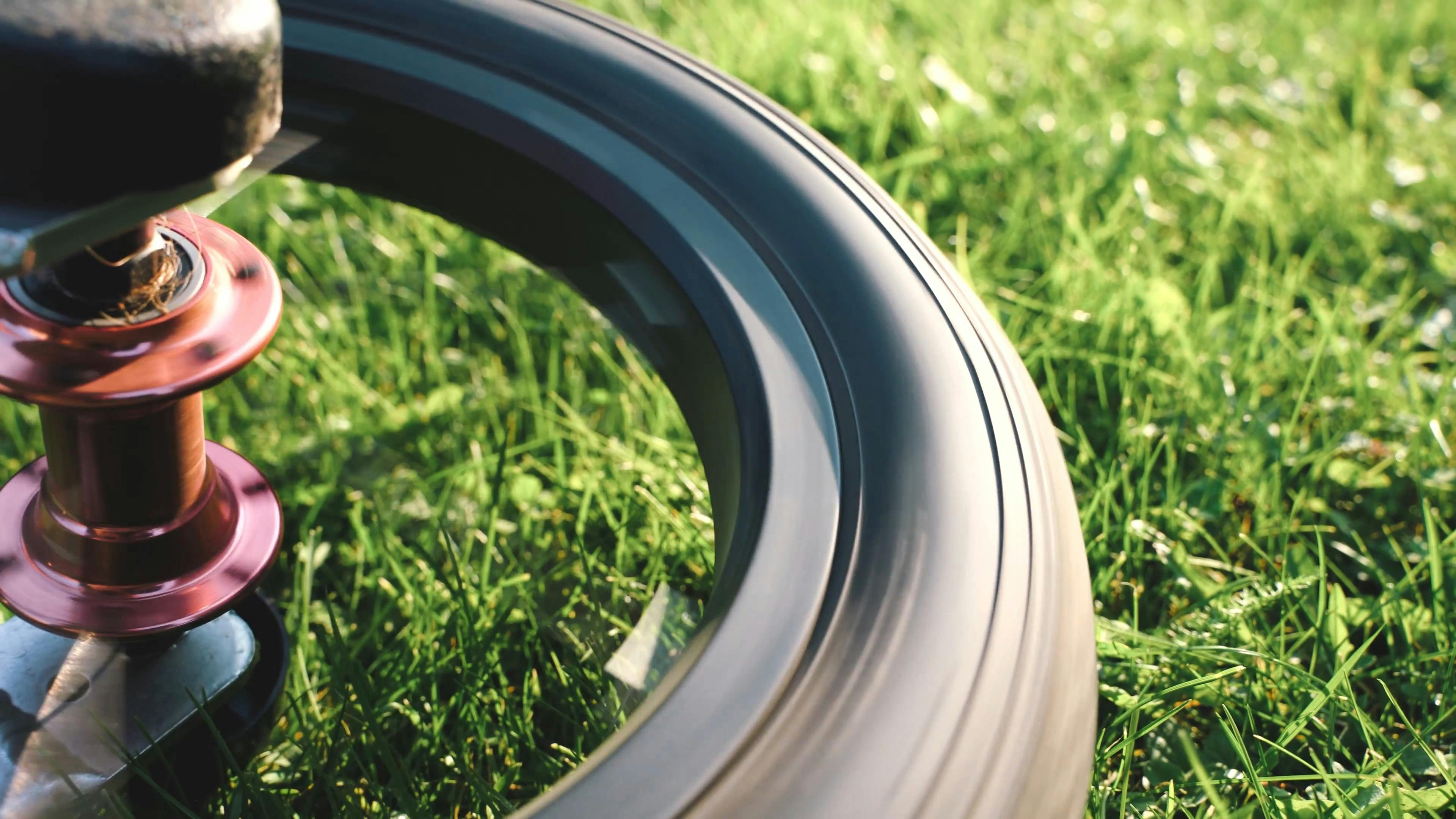 Spinning Wheel of a Bicycle on the Ground · Free Stock Video