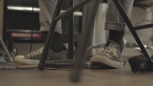 A Person Stepping on a Tattoo Pedal
