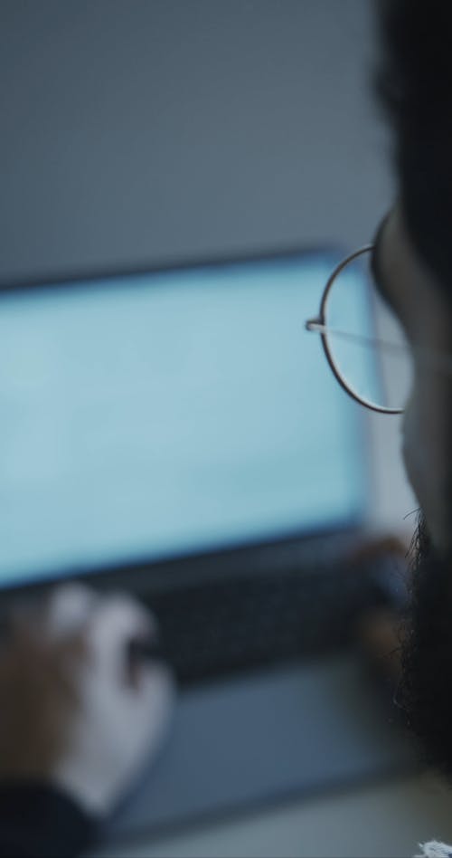 A Man Using a Laptop