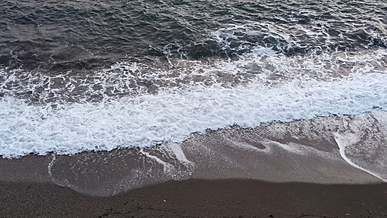 sea waves crashing on beach shore