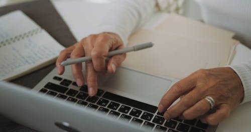 An Elderly Woman Using A Laptop