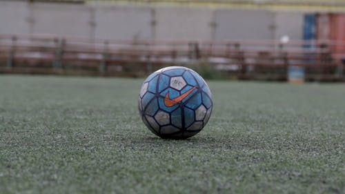 Person Kicking a Football