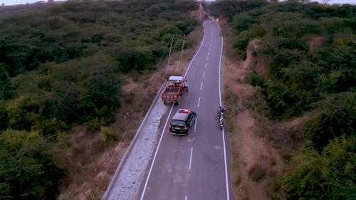 Drone Footage of a Police Car Driving on Long Highway
