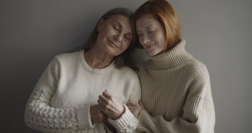 Mom and Daughter Leaning to Each Other