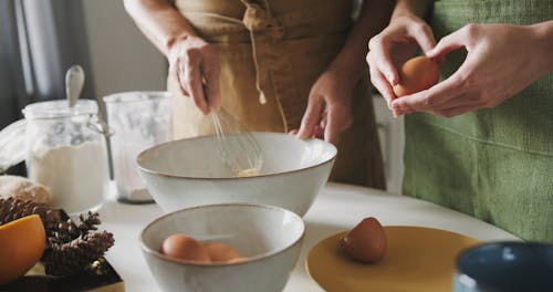 Cracking Eggs Into A Bowl