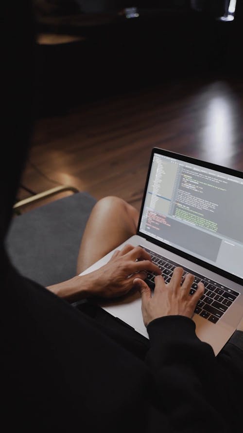 A Person Busy Working on His Laptop