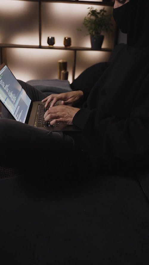 A Person Busy Working on His Laptop