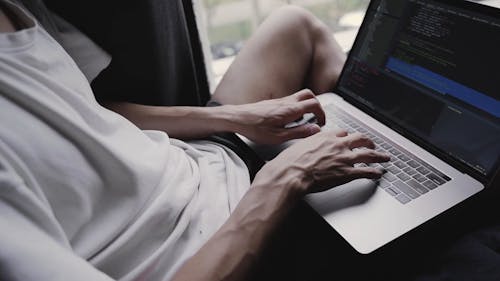 A Person Busy Working on His Laptop