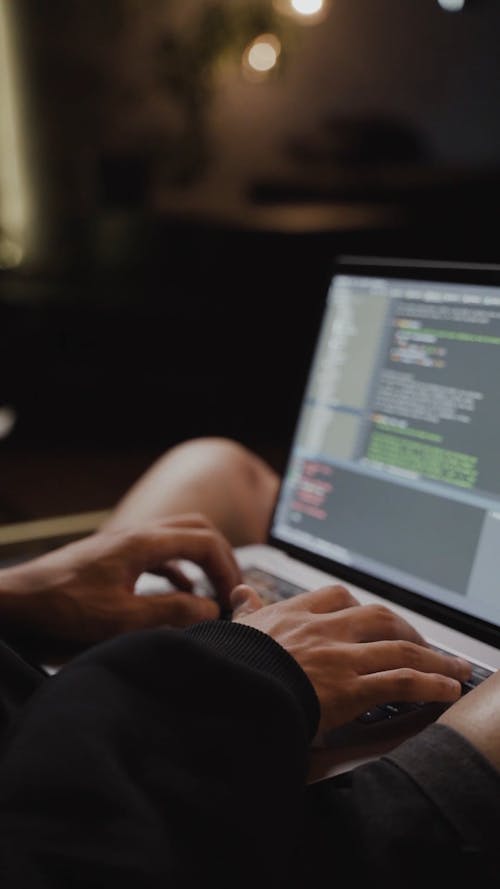 A Person Busy Working on His Laptop