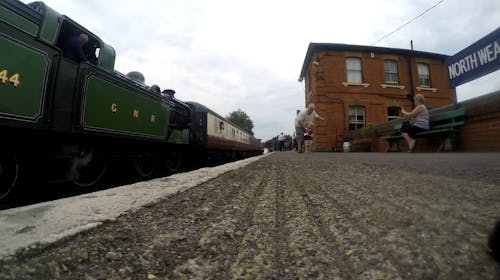 Low Angle Shot of a Train Leaving from the Railway Station