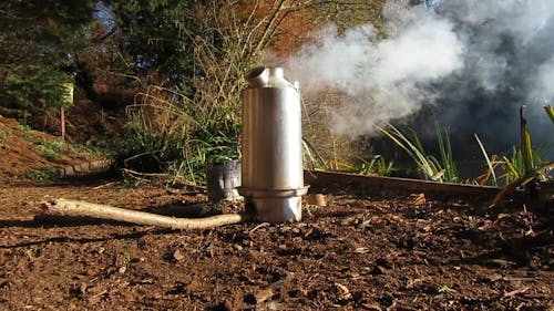 A Steaming Kelly Kettle on the Ground