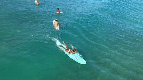 Drone Footage of a Woman Surfing