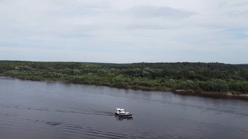Drone Footage of a Boat Sailing on the River