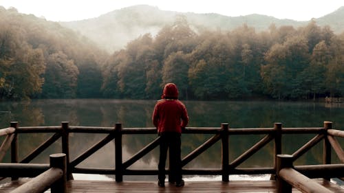 A Man Relaxing by the Placid Lake