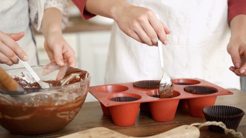 Two Women Preparing A Chocolate Batter For Baking Free Stock Video ...