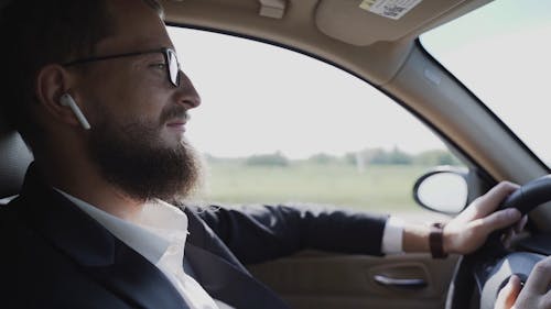 A Man Driving His Car