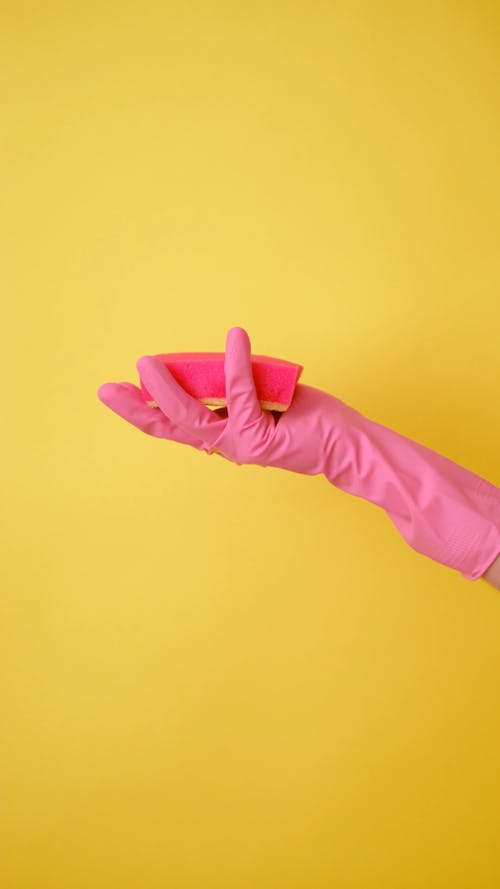 A Person Squeezing a Sponge