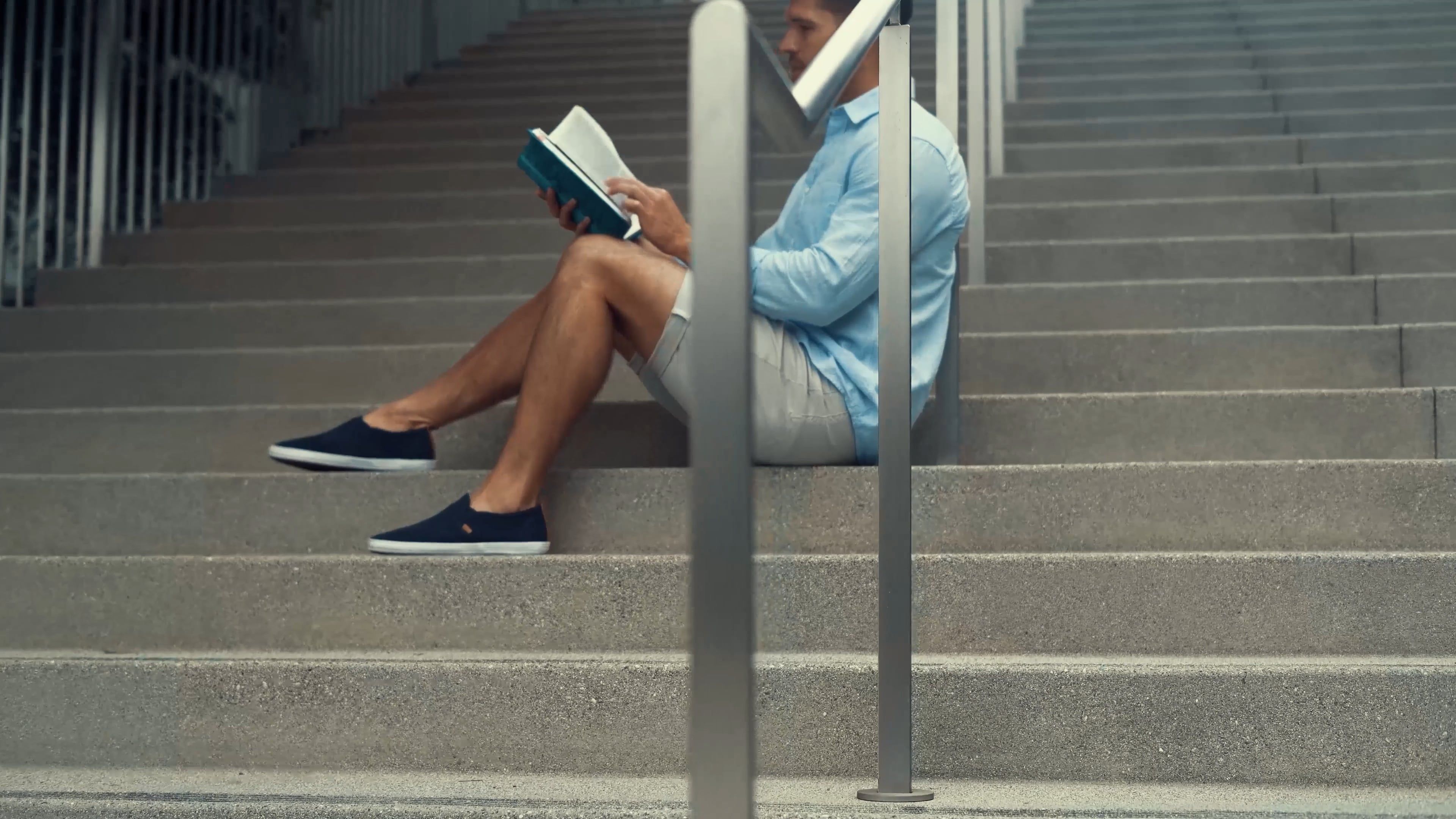 Man Sitting on Stairs and Reading a Book Free Stock Video Footage ...