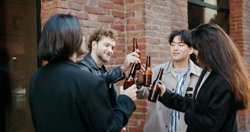 Group of Friends Toasting and Drinking Their Beers