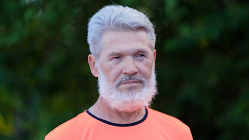 A Man With White Hair Looking at the Camera