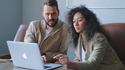 A Man And A Woman Collaboration At Work