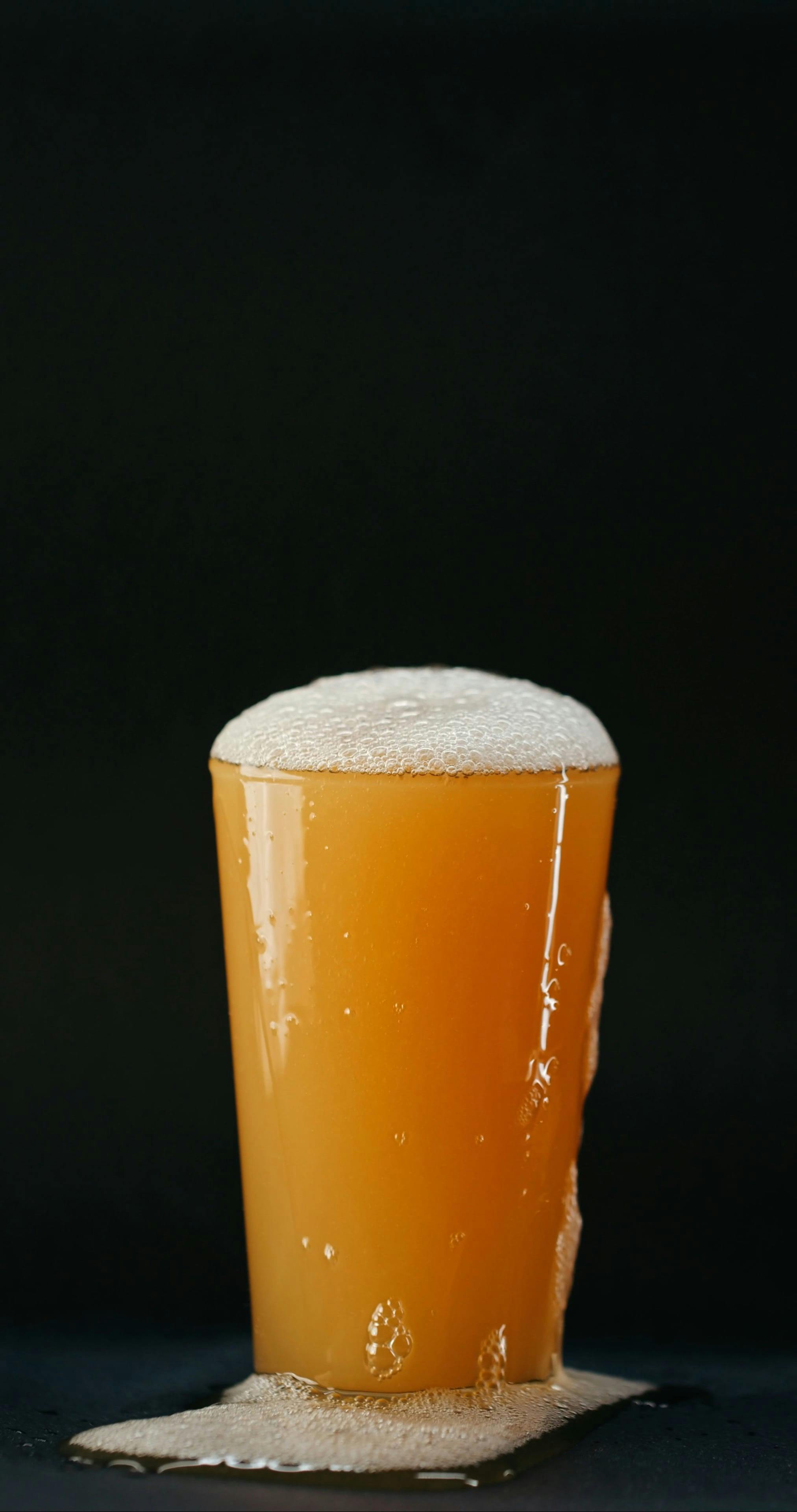 Beer Foam Flowing Out of the Glass · Free Stock Video