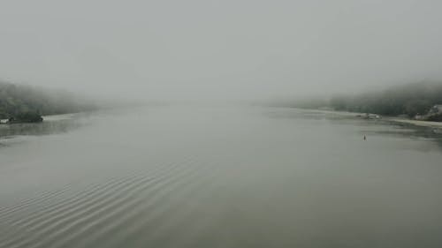 Aerial View of a Foggy Lake