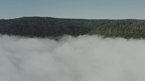 Drone Footage of a Foggy Mountain