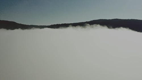 Drone Footage of a Foggy Mountain