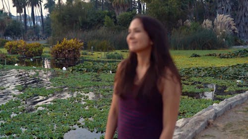 Woman Walking at a Park