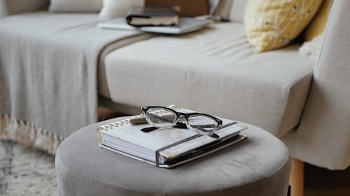 A Diary and Laptop Placed on a Couch